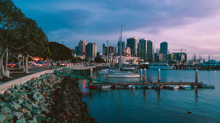 Twilight evening picture of boats moored in san diego harbor with the san diego downtown skyline behind