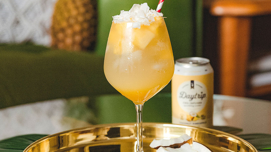 vibrant cocktail photo of the endless summer featuring Daytrip CBD Infused Sparkling Water