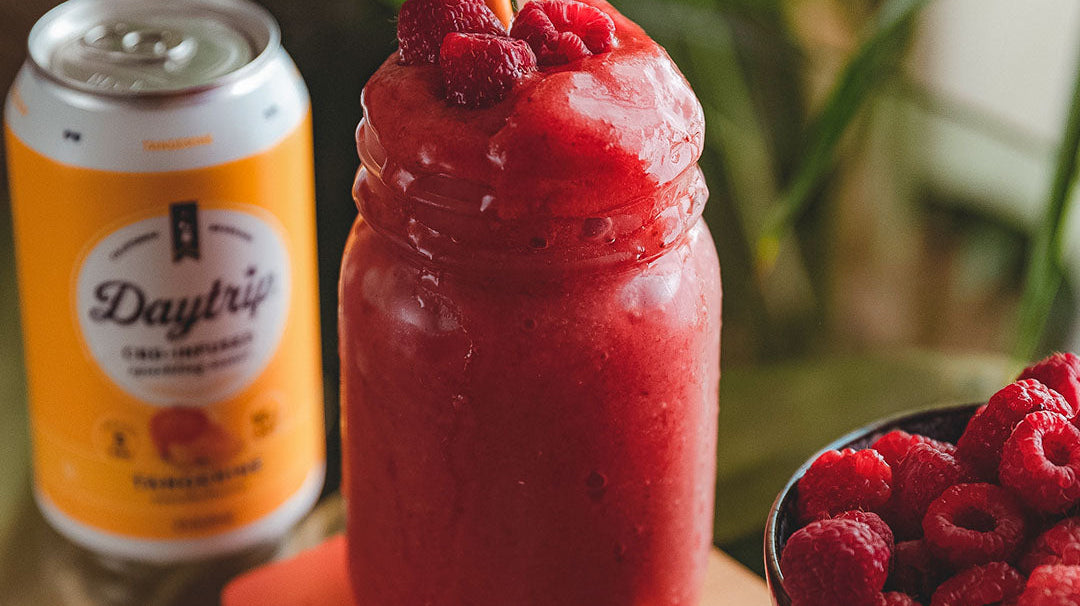 vibrant cocktail photo of the bright side slushy featuring Daytrip CBD Infused Sparkling Water