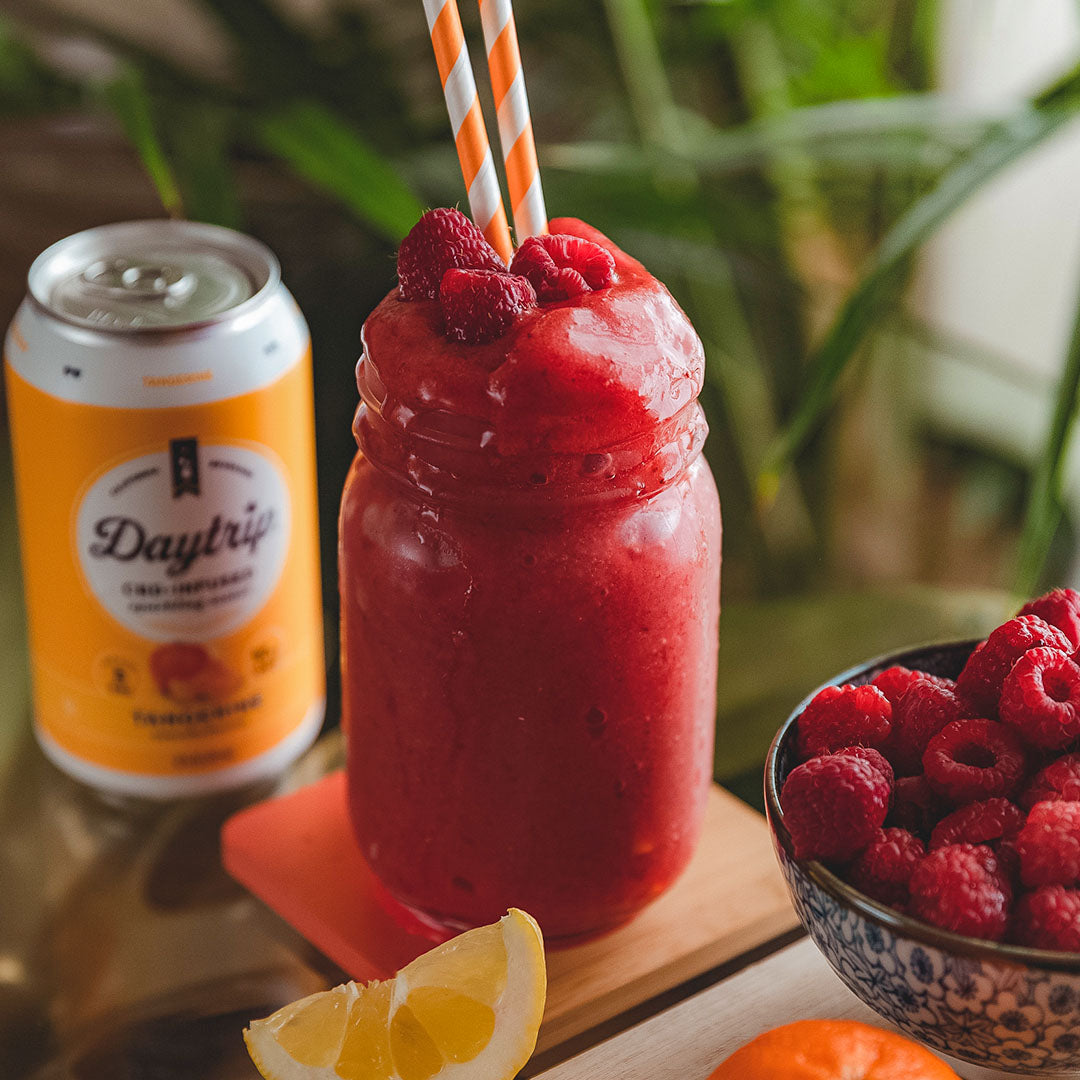 vibrant cocktail photo of the bright side slushy featuring Daytrip CBD Infused Sparkling Water